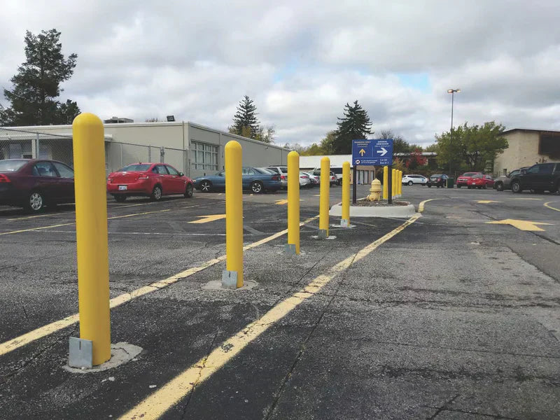 Steel bollard pole installed in parking lot for safety bollard protection 