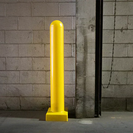 Steel bollard posts with yellow bollard covers improving visibility in parking lot 