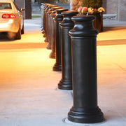 Bollards and Sleeve's 10" Pawn Decorative Bollard Covers Protecting a Sidewalk