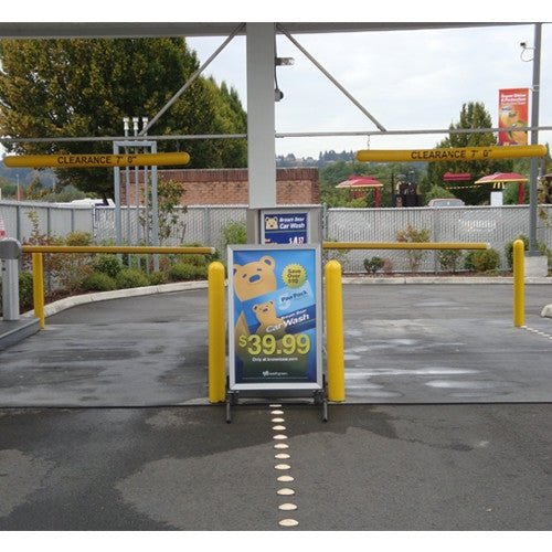 Bollards and Sleeve's 4" Clearance Bars and Bollard Covers at a Car Wash drive-thru
