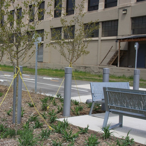 Bollards and Sleeve's 6" Cinco Decorative Bollard Covers on a bike path 