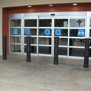 Bollards and Sleeve's 6" Metro Decorative Bollard Covers Protecting a Storefront 