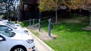 Electric Vehicle Charging Stations lined up in a parking lot 