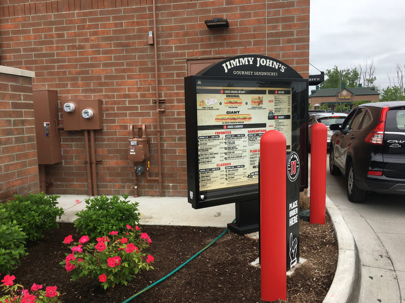 1/8" Red Bollard Covers at a drive-thru 