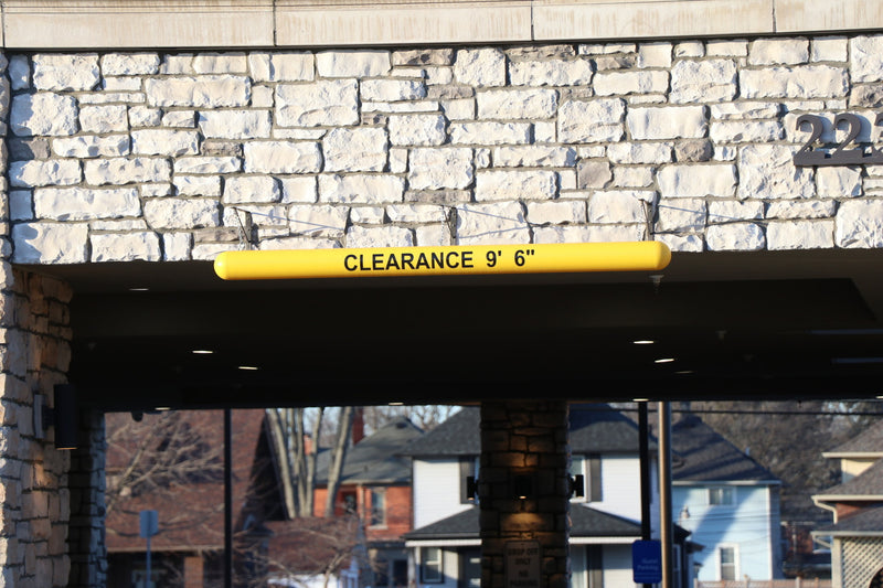 4" Hanging Clearance Bar at a hotel entrance 