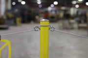 Close up of the Warning Line System stanchion post's eye hooks with the wire 