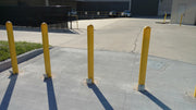 Removable Locking Bollards with Yellow Bollard Covers 