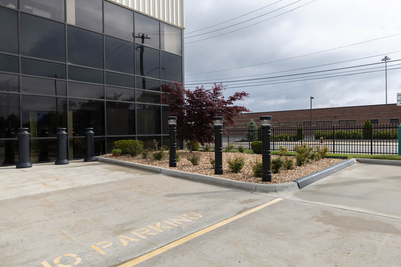 UV Lighted Bollard Covers in a parking lot 