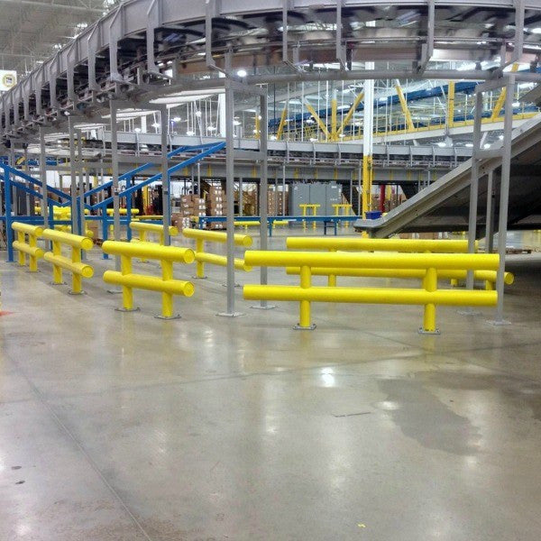 Two Line Heavy Duty Guardrail lining a forklift lane in a manufacturing facility